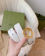 Gucci belt in white with embossed logo strap and gold interlocking G buckle