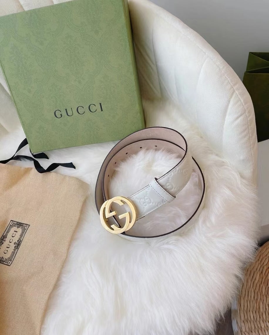 Gucci belt on loop: white embossed strap with gold interlocking G buckle