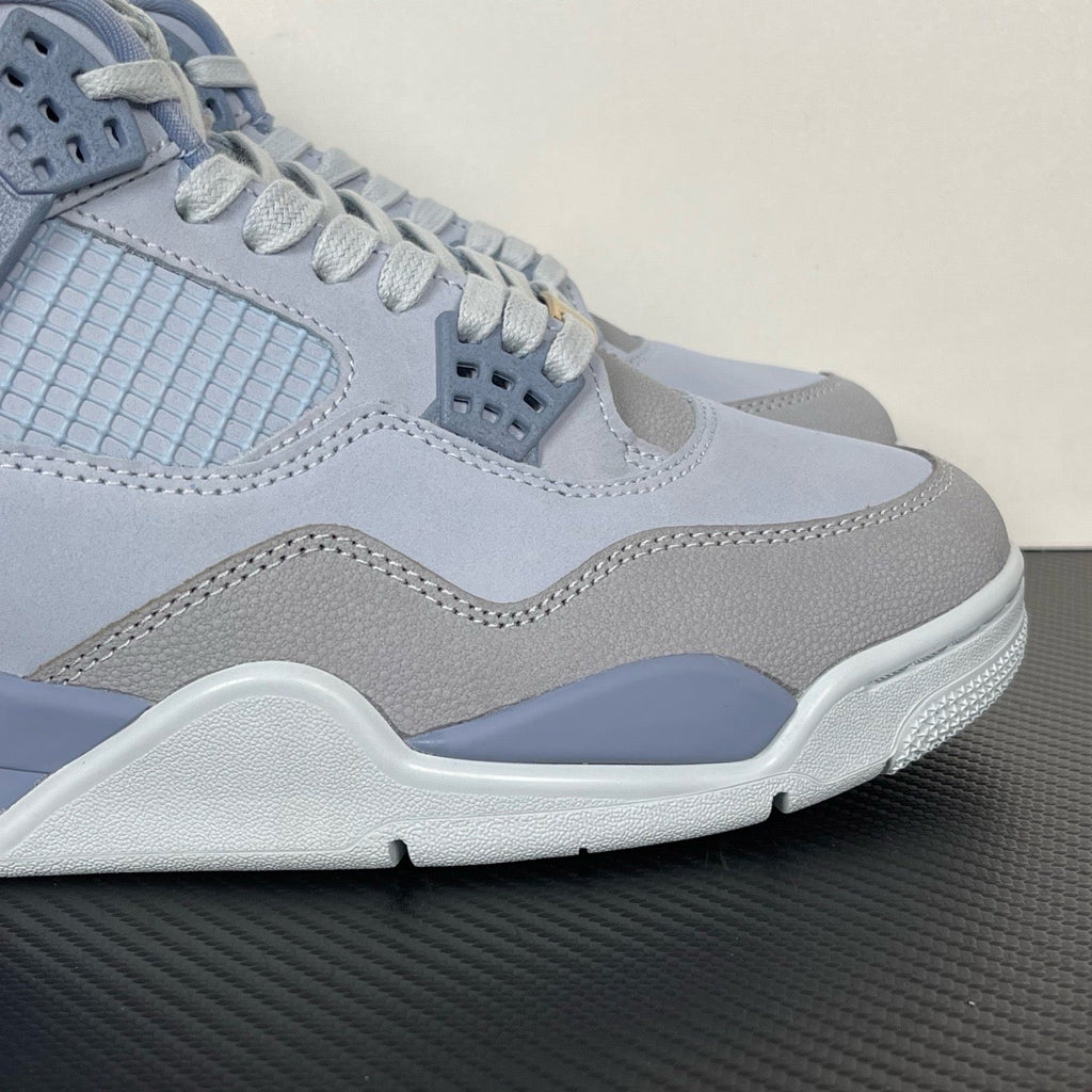 Close-up of light blue Air Jordan 4 midsole and side panel with stitched seam