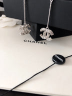 Chanel logo rhinestone pendant earrings with silver-tone chains and loops
