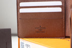 Louis Vuitton brown cardholder, embossed logo and inner card slots