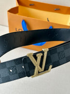 Belt detail view: dark checkered strap with gold-tone LV buckle and textured black leather