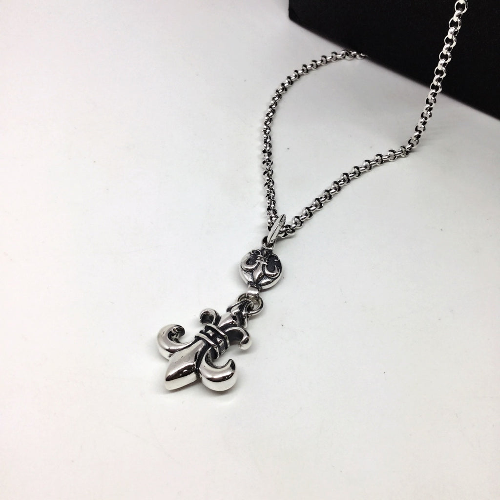 Silver chain necklace with anchor-shaped and floral charms