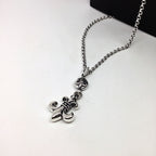 Silver chain necklace with anchor-shaped and floral charms