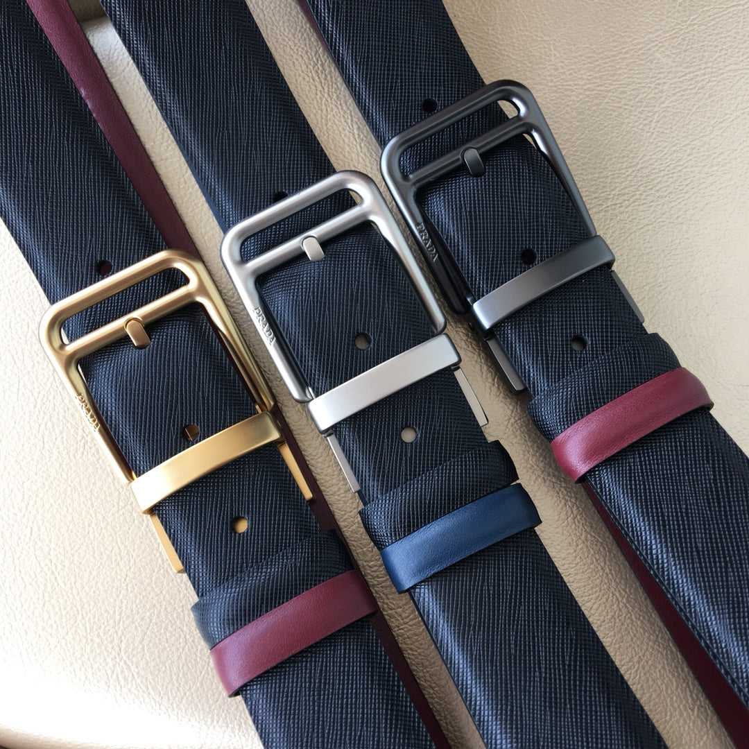 Set of dark blue belts with silver buckles and burgundy leather keepers