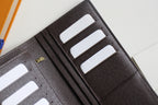 Louis Vuitton small wallet interior with black leather, stitched edges, and card slots