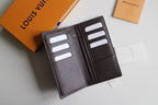 Louis Vuitton small wallet open, gray lining with multiple card slots and interior logo