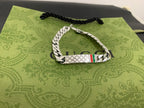 White leather and silver chain bracelet with Gucci logo tag and hanging charm