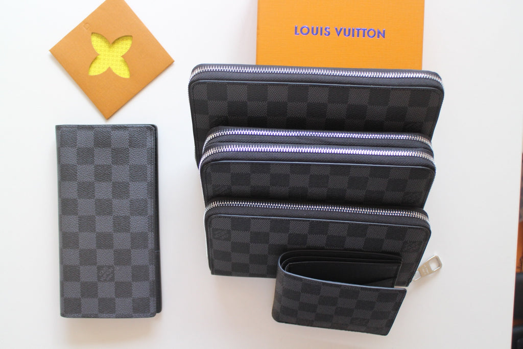 Louis Vuitton small zip pouches with dark checker pattern and top zip pockets