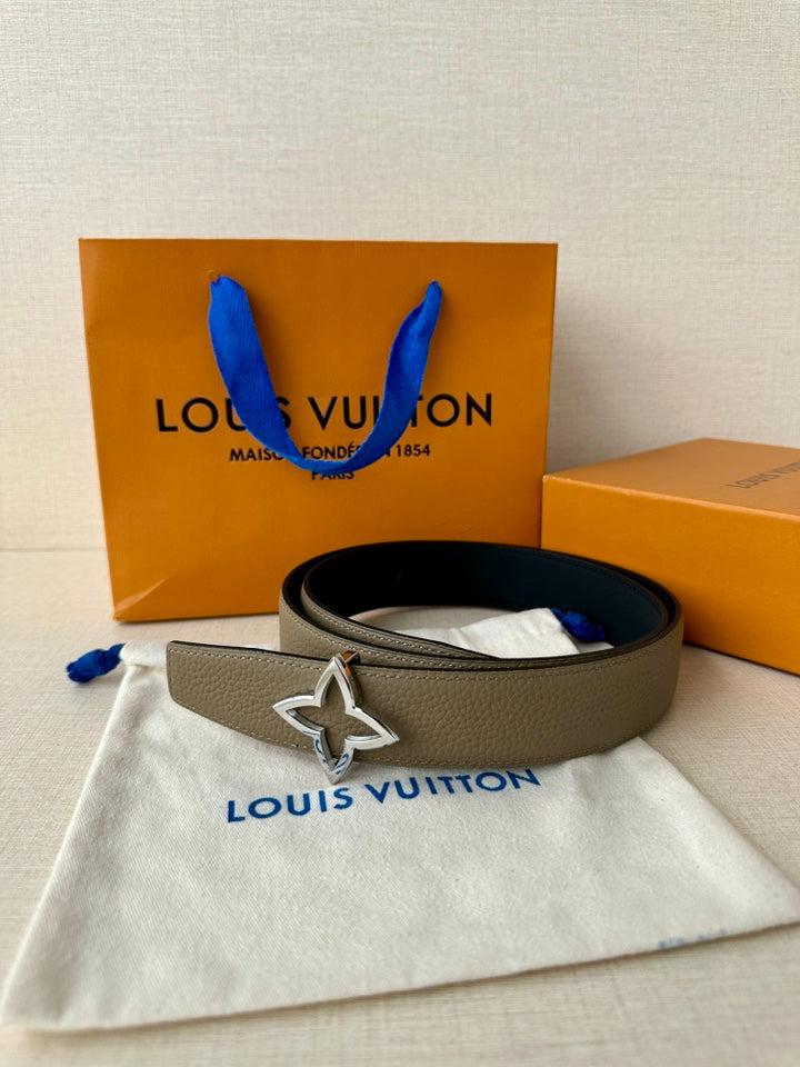 Louis Vuitton belt with light gray strap and silver star buckle