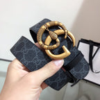 Gucci belt in dark monogram with gold buckle and textured keeper
