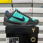 Black and teal basketball shoe shown in side view with blue swoosh detail.
