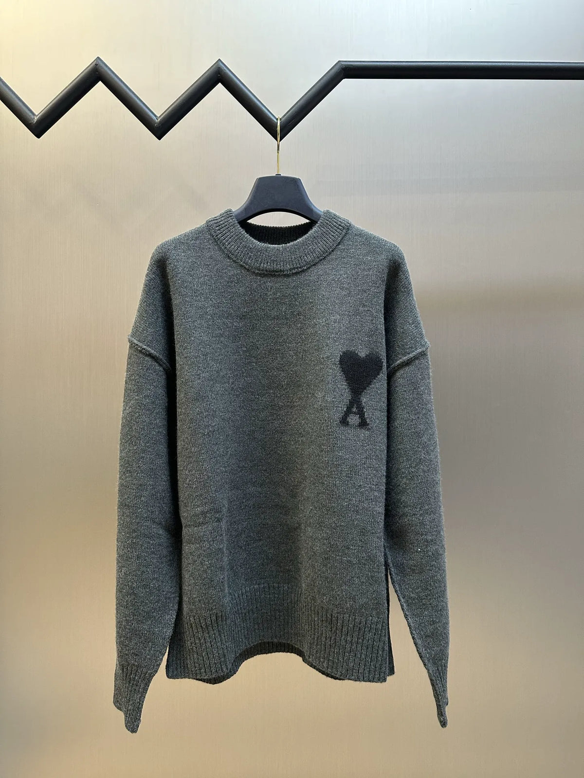 Long-sleeve knit sweater in heather gray with heart-and-A logo on chest