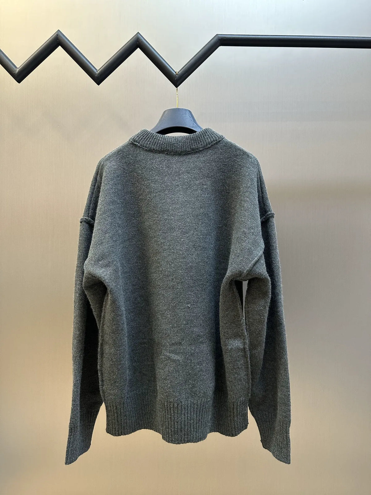 Long-sleeve knit sweater back view in heather gray