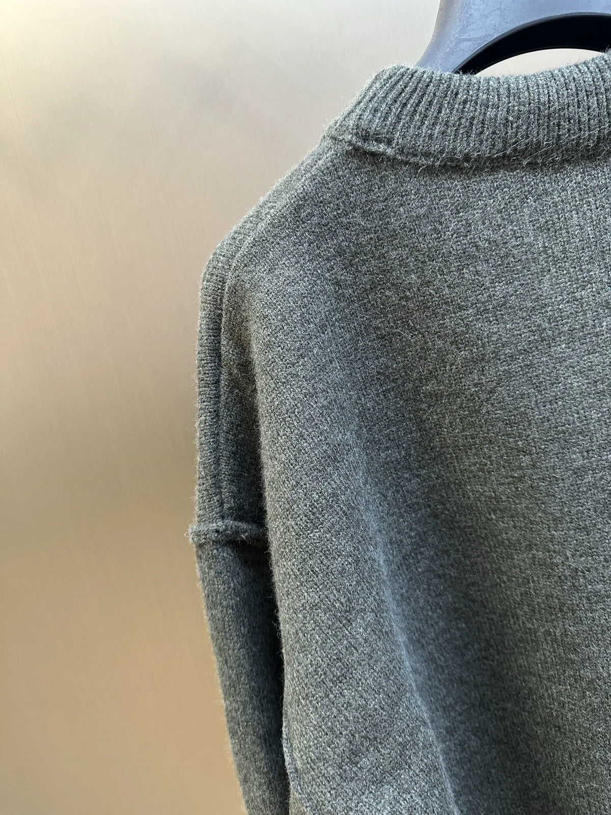 Heather gray knit sweater with ribbed turtleneck collar