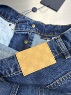 Dark blue denim jeans with yellow check-pattern card holder at the waistband.