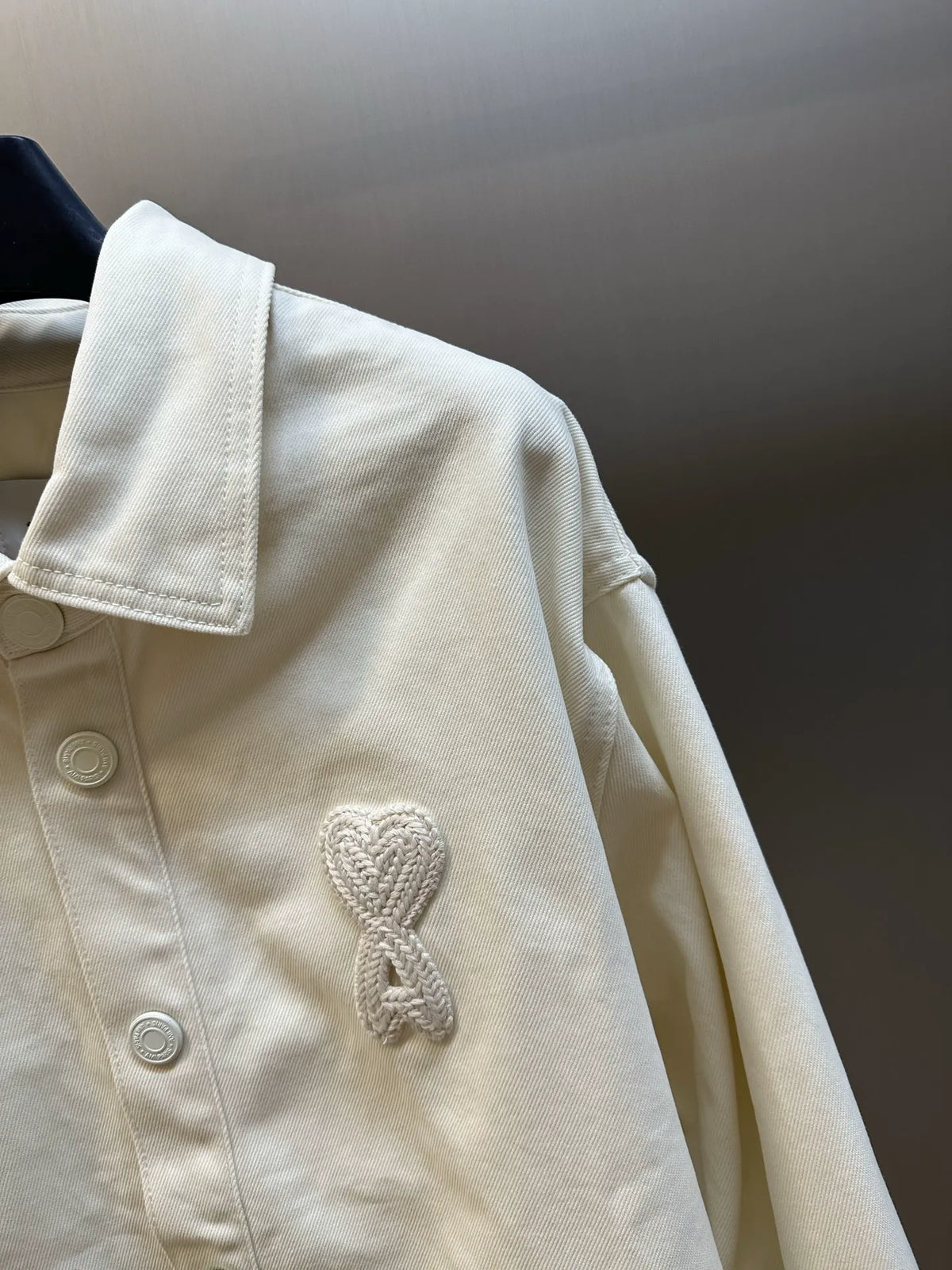 Cream shirt sleeve and back yoke with embroidered heart emblem
