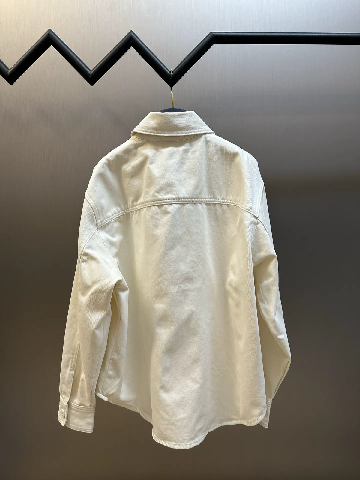 Cream long-sleeve button-up shirt back view with stitched yoke