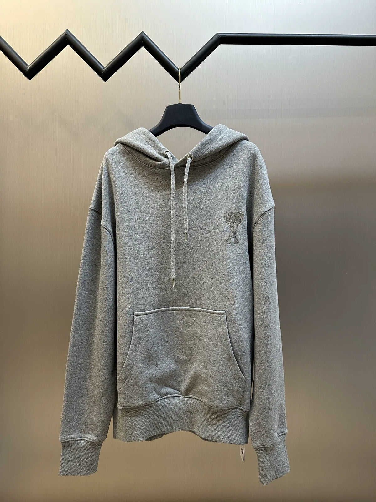 Gray long-sleeve hoodie with drawstring hood and front kangaroo pocket