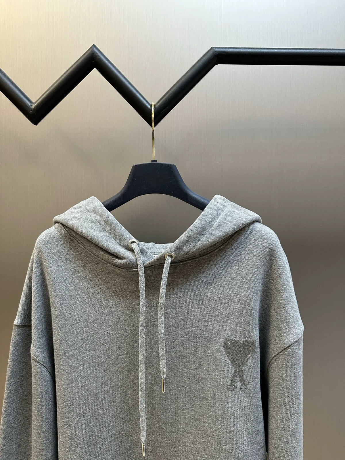 Gray pullover hoodie with drawstring hood, backless? kangaroo pocket not visible