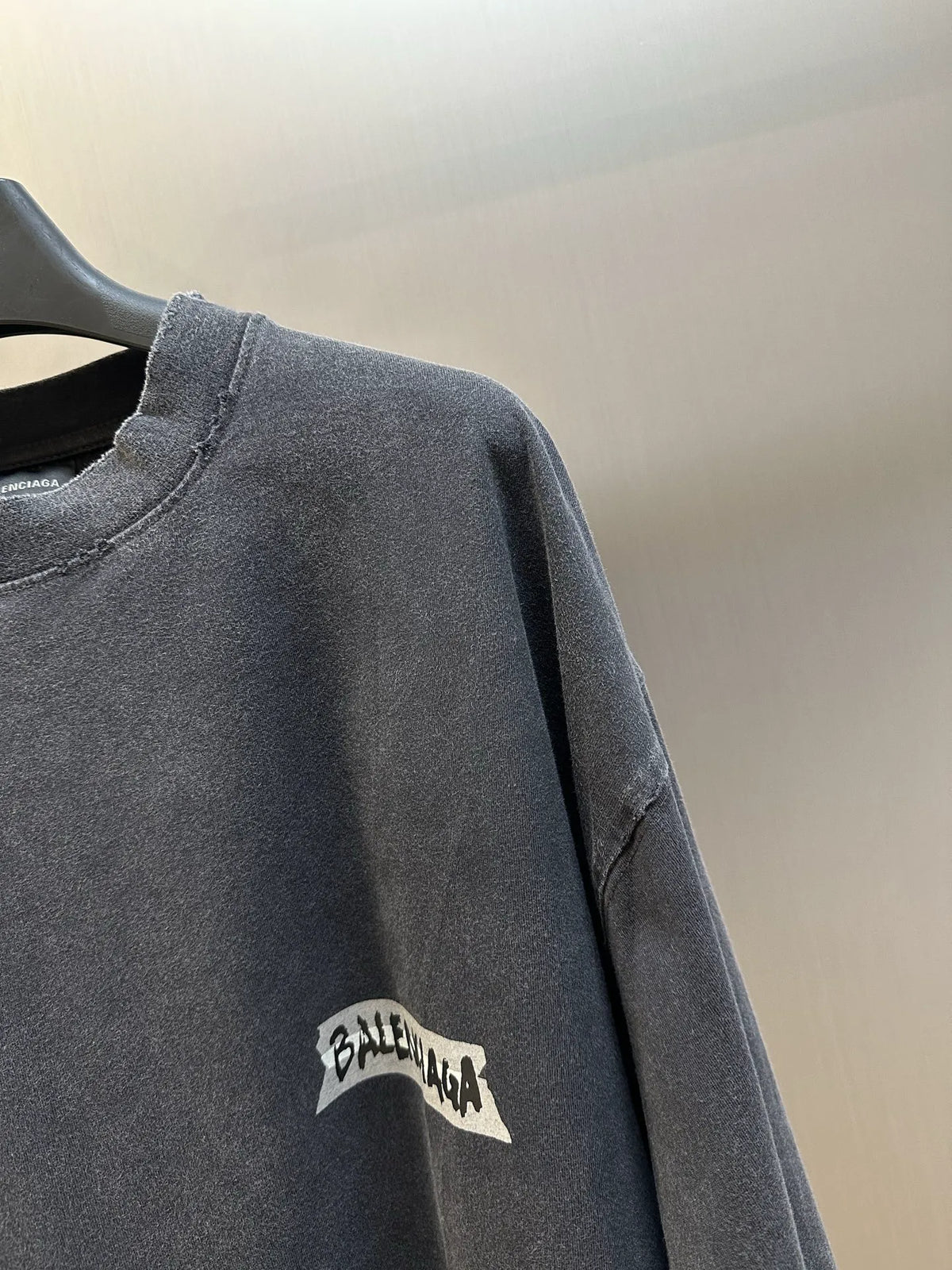 Charcoal long-sleeve sweatshirt sleeve with Balenciaga graphic patch