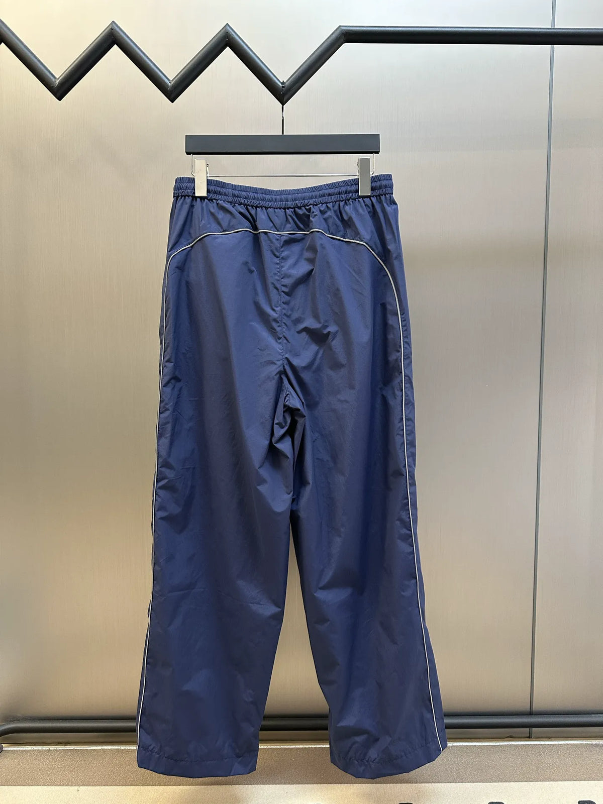 Navy Balenciaga pants with elastic waistband and relaxed wide leg fit