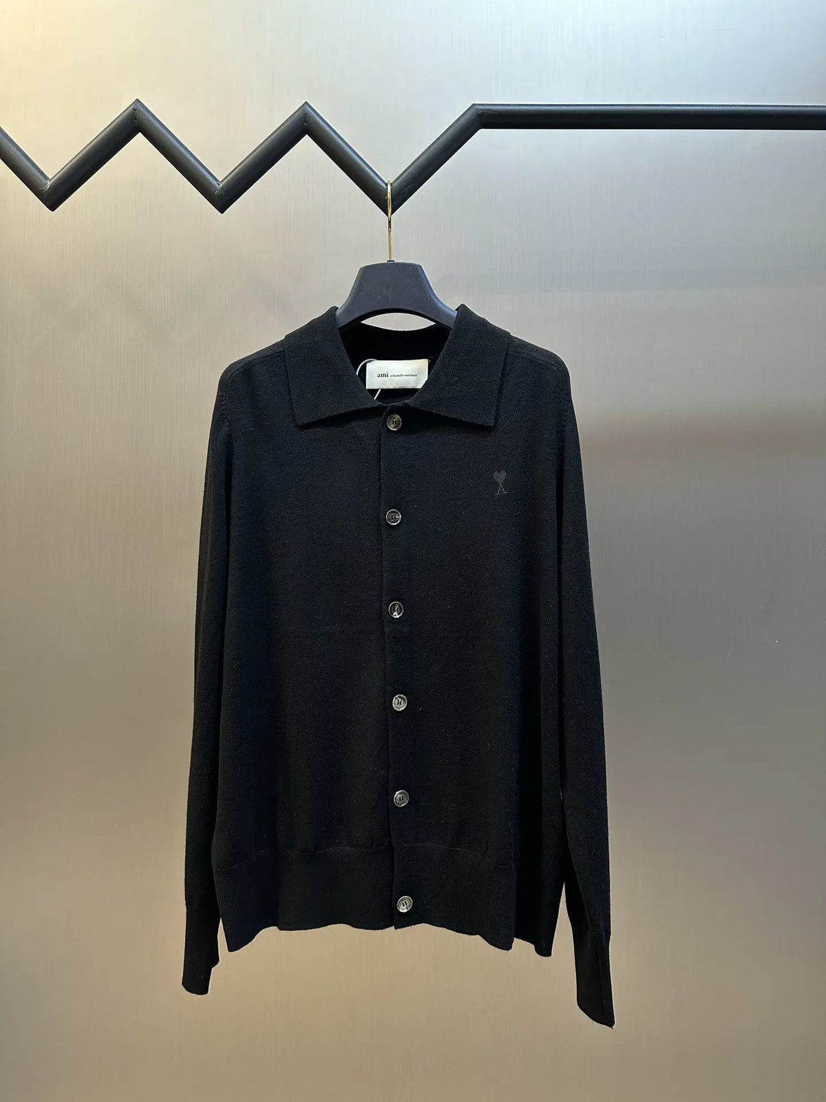 Amiri black button-up coat with point collar and long sleeves