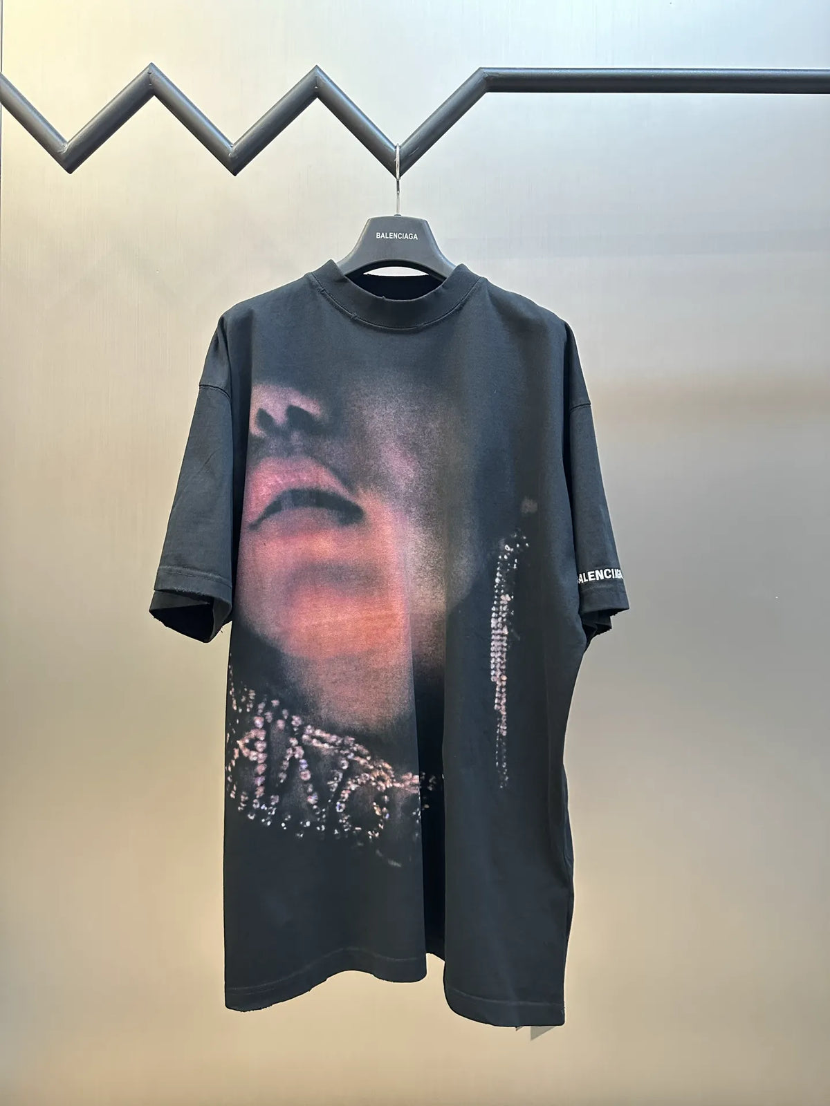 Black graphic Balenciaga T-shirt with large face print and rhinestone accents at sides