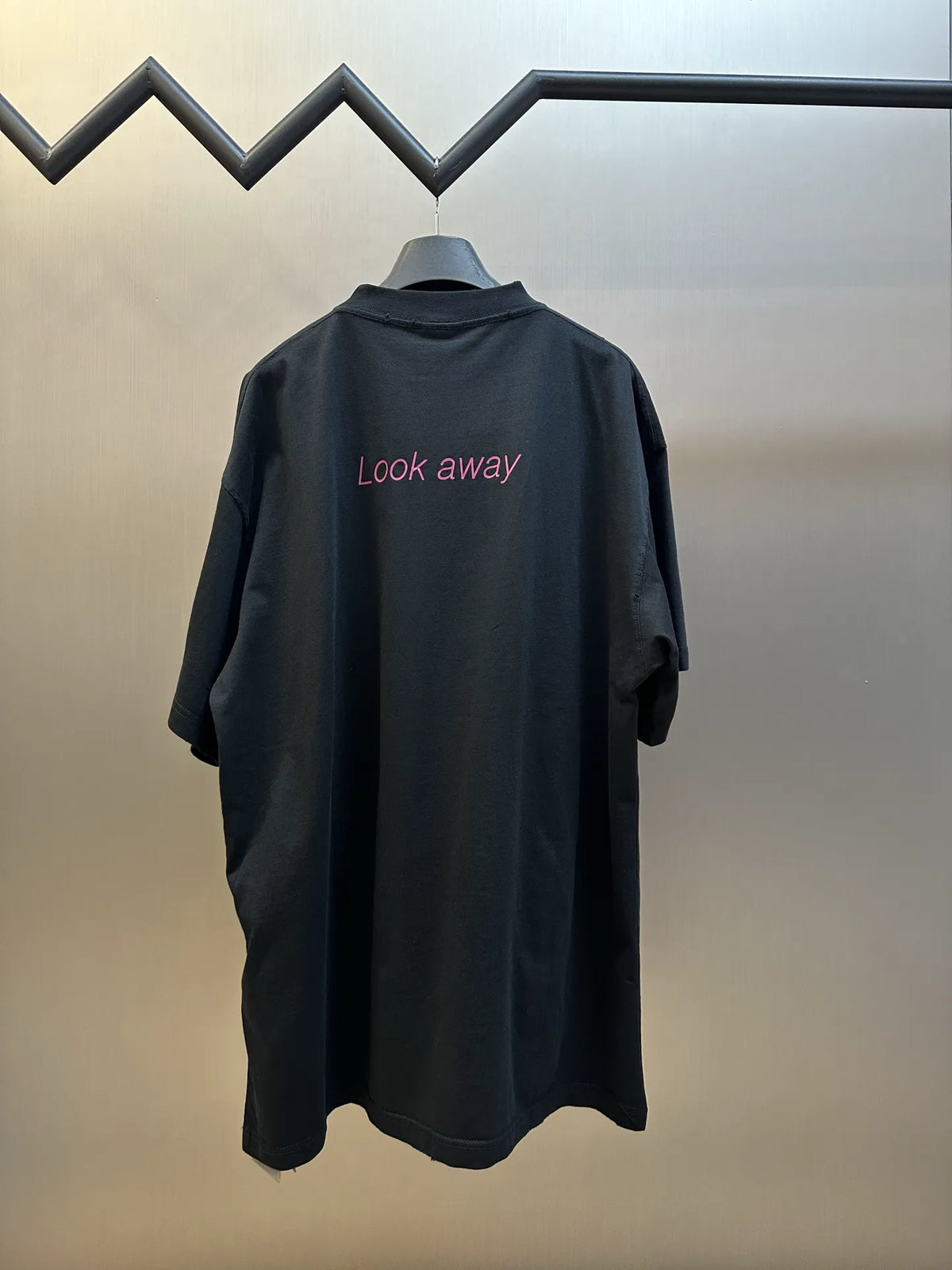 Black Balenciaga T-shirt back with pink "Look away" text