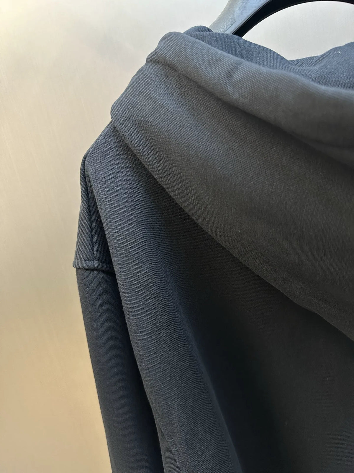 Black hoodie hood and shoulder area in solid fabric