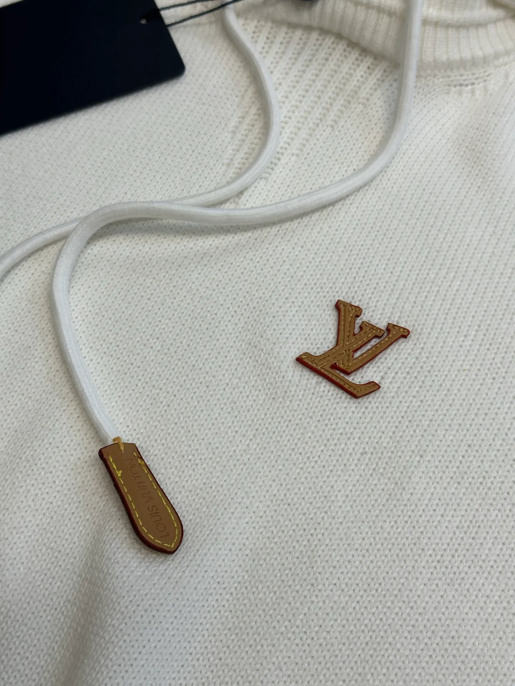 Cream hoodie chest with brown LV logo and white drawstrings