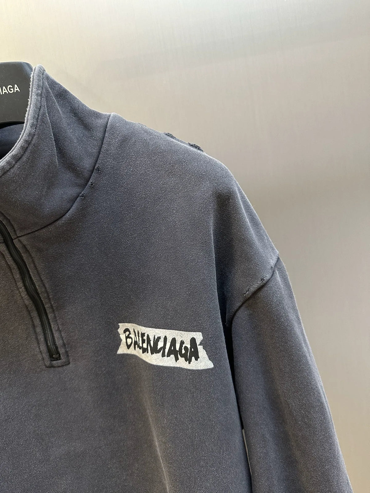 Balenciaga dark gray long-sleeve quarter-zip top with chest logo patch detail