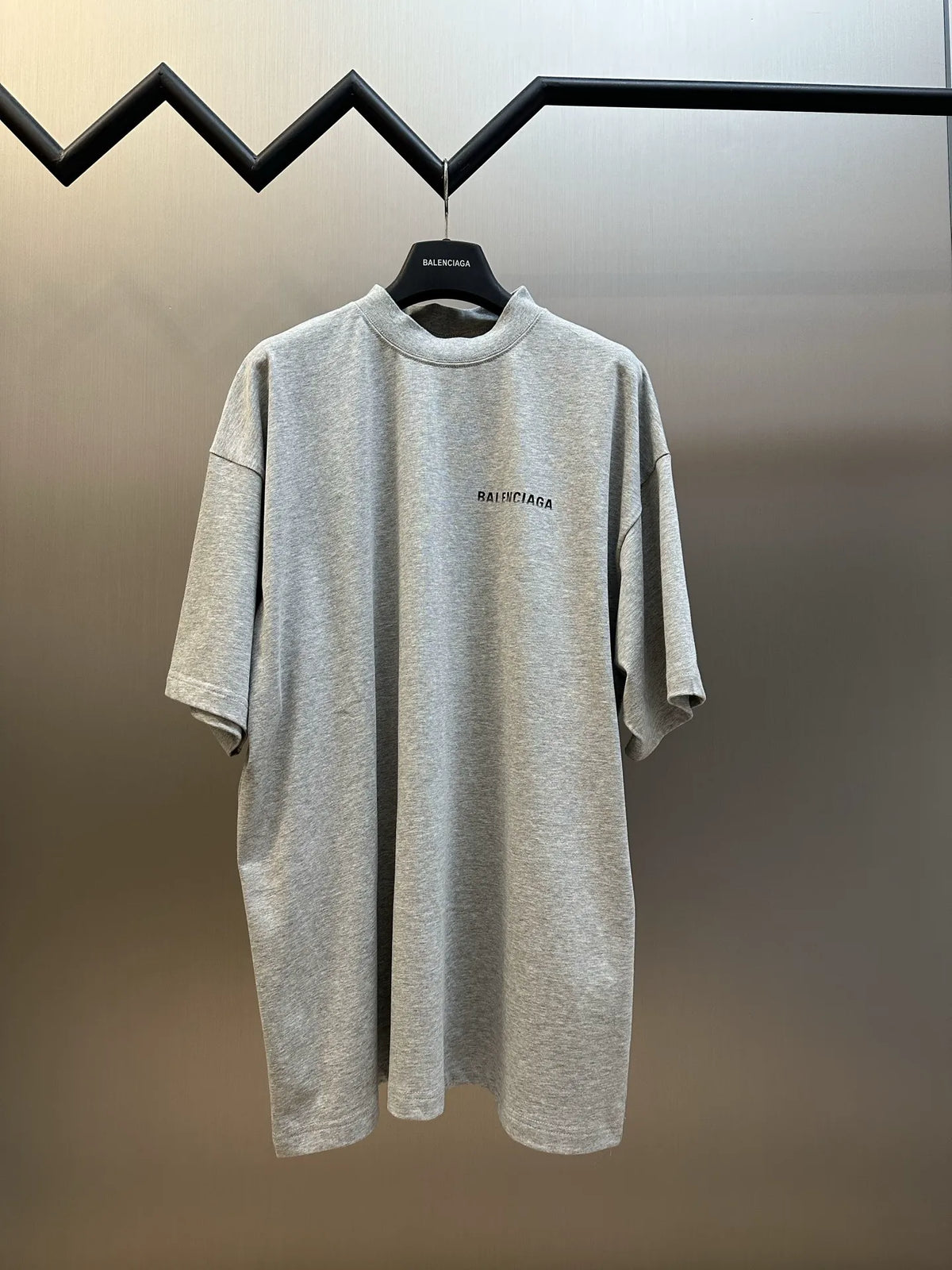 Light gray short-sleeve T-shirt on hanger, crew neck, small Balenciaga chest logo