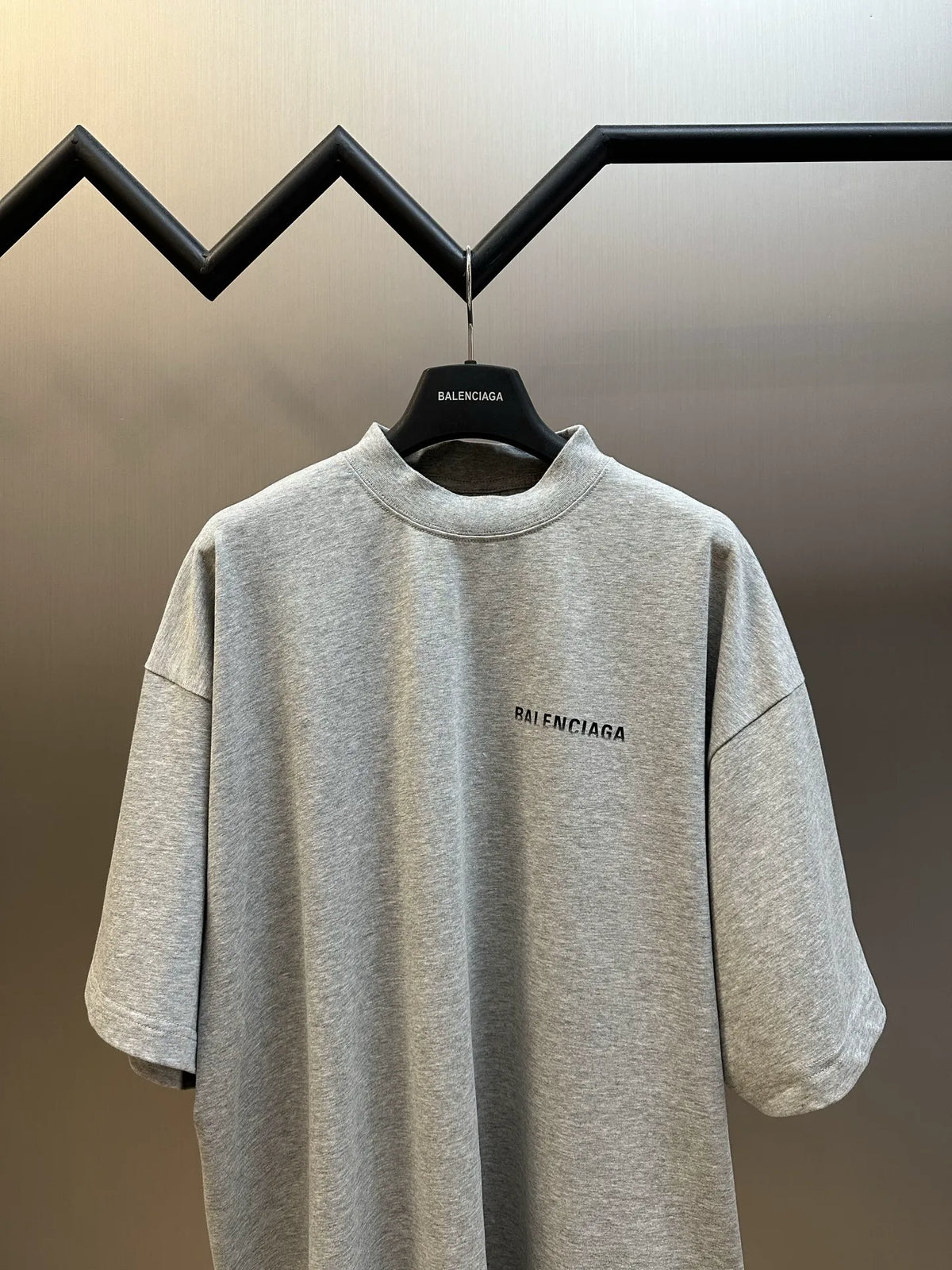 Light gray crew-neck T-shirt with Balenciaga logo at chest, short sleeves