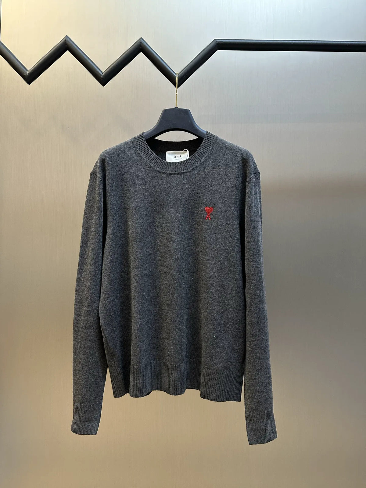 Amiri long-sleeve knit sweater in dark gray with red heart logo on chest