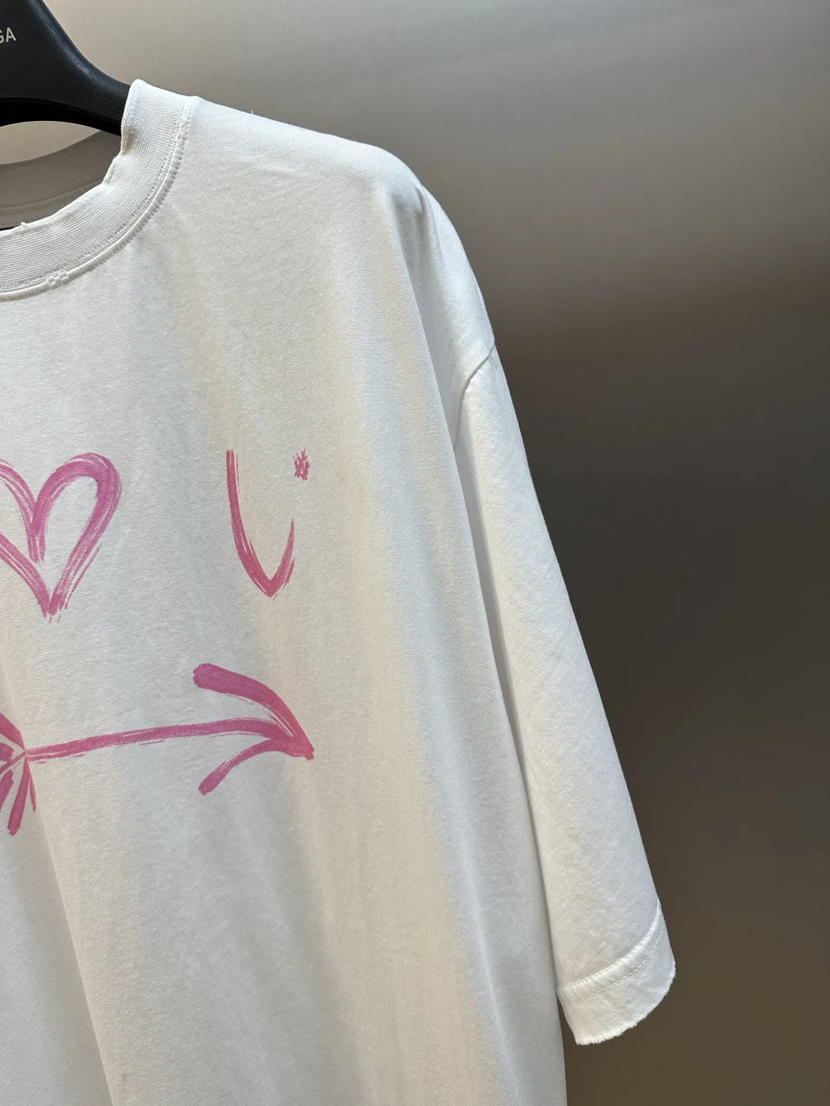 Balenciaga white short-sleeve T-shirt with pink graphic print on sleeve and chest