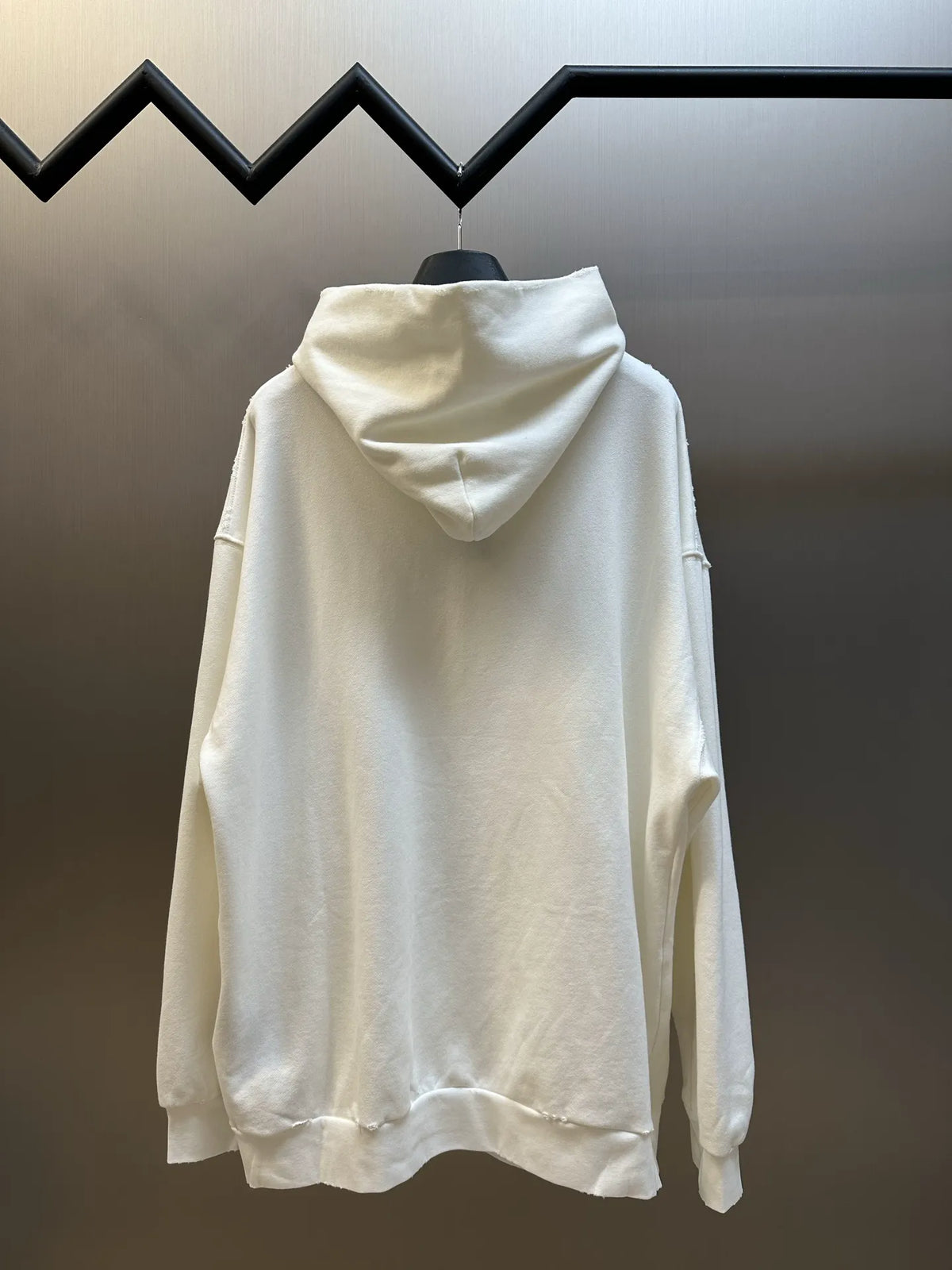 White long-sleeve hoodie with hood and full back view, no front logo visible