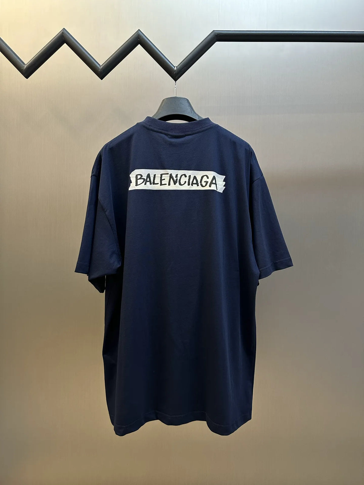 Navy Balenciaga back logo short-sleeve T-shirt on hanger