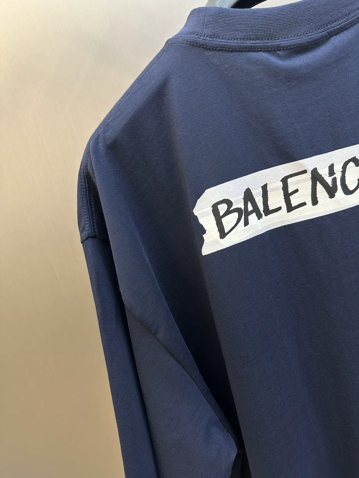 Navy Balenciaga T-shirt sleeve with large partial logo print