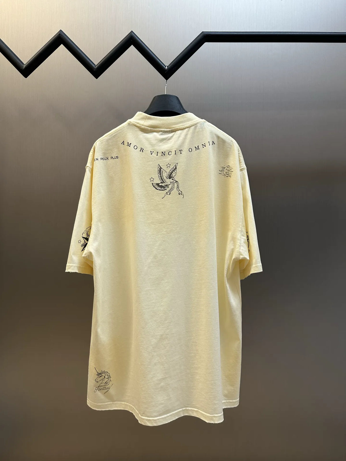 Cream short-sleeve T-shirt with back print featuring bird graphic