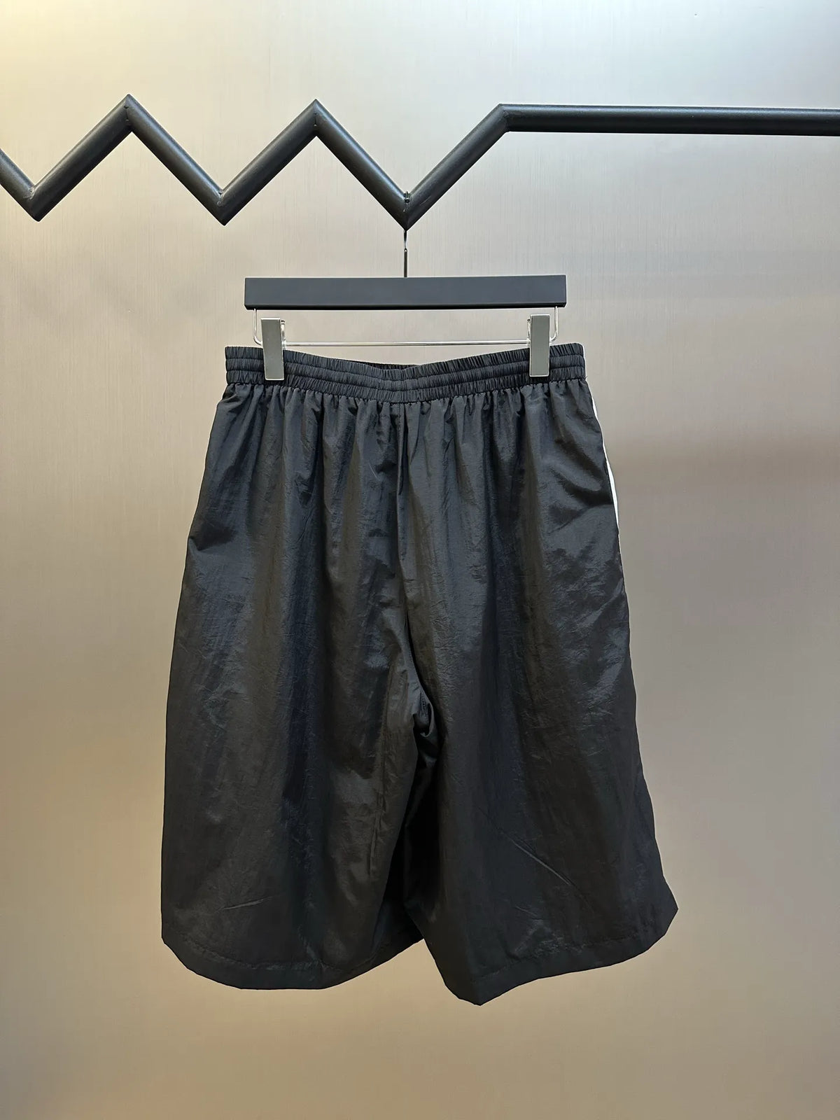 Balenciaga black shorts back view with elastic waistband and wide side panels