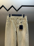 Light beige LV monogram pants, front view with belt loops and front pockets