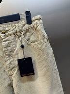 Light beige LV monogram denim pants, side view with front pocket and logo tag