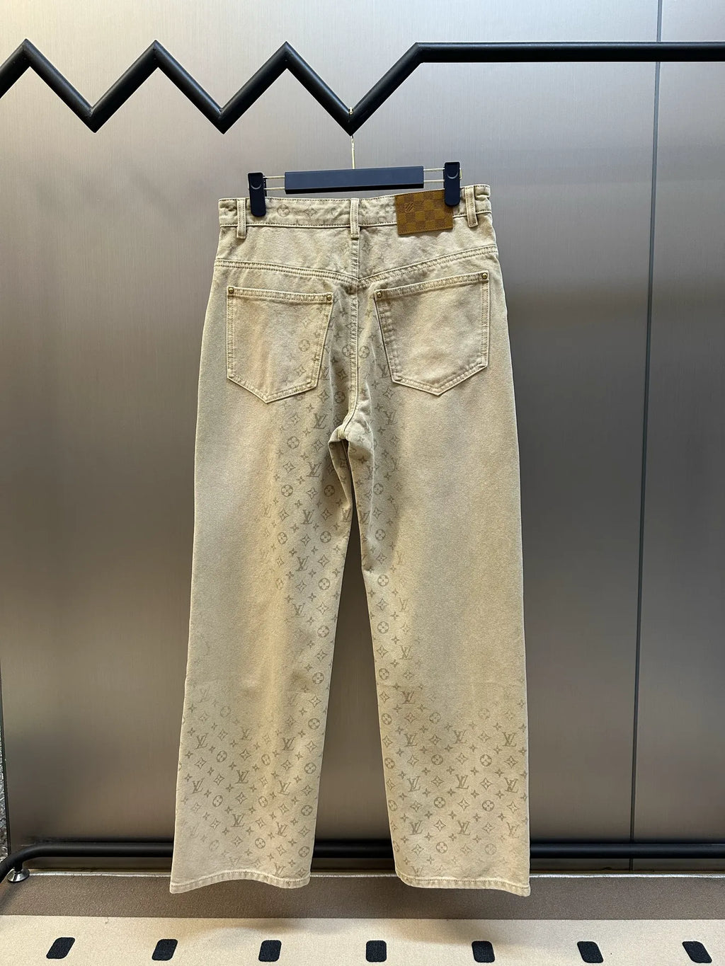 Light beige LV monogram pants, back view with two rear pockets and waistband