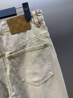 Light beige LV monogram pants, front pocket detail with stitched seams