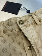 Light beige LV monogram pants, waistband detail with metal buttons and hanging tag