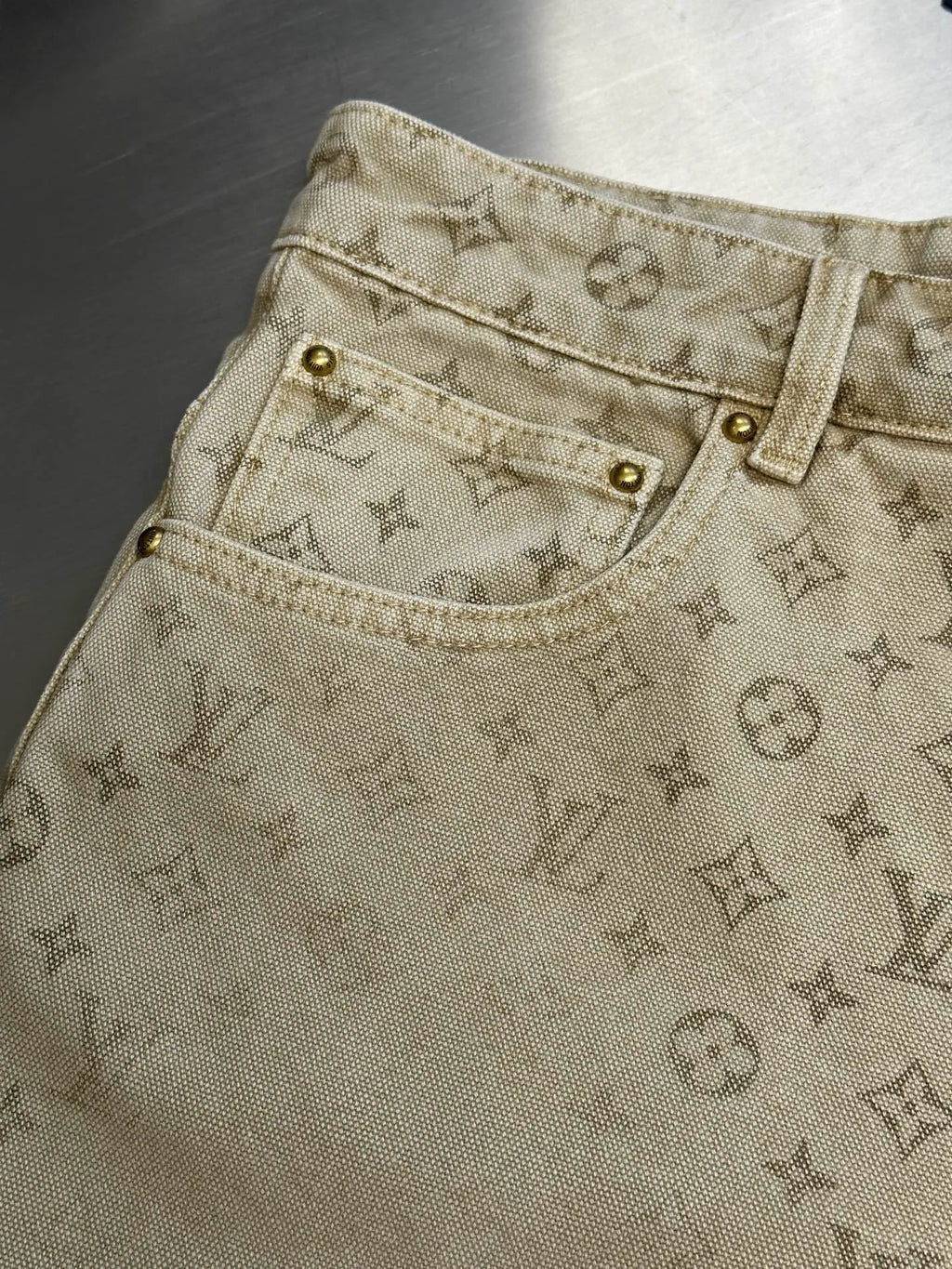 Light beige LV monogram pants, upper front with belt loops and metal rivets