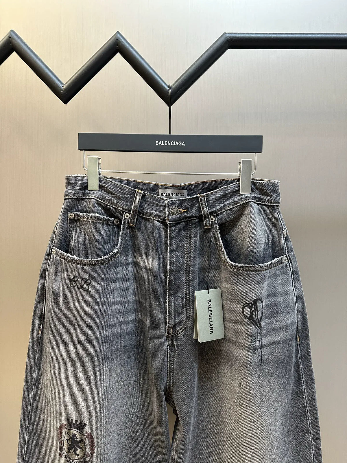 Balenciaga dark blue denim pants with front pockets, button fly, and hanging tag