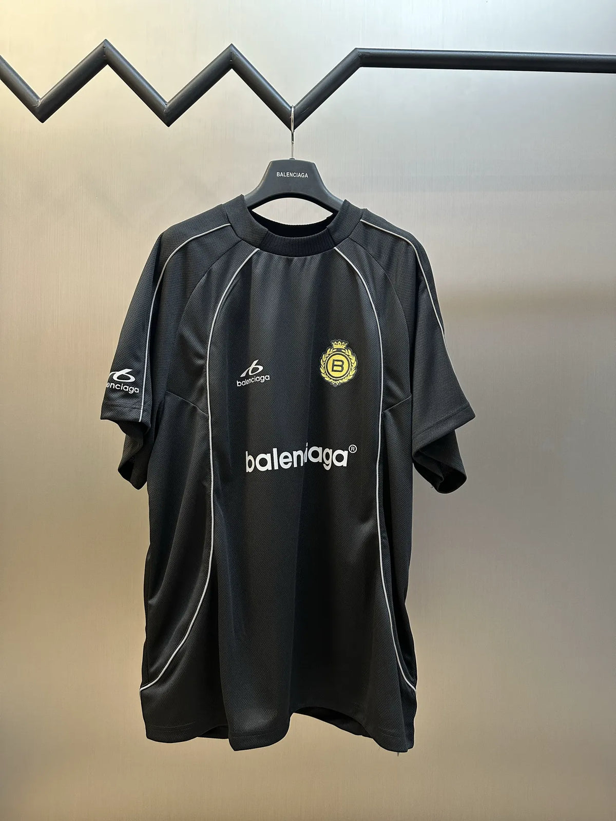 Black Balenciaga short-sleeve athletic jersey with front sponsor logos and crew neck