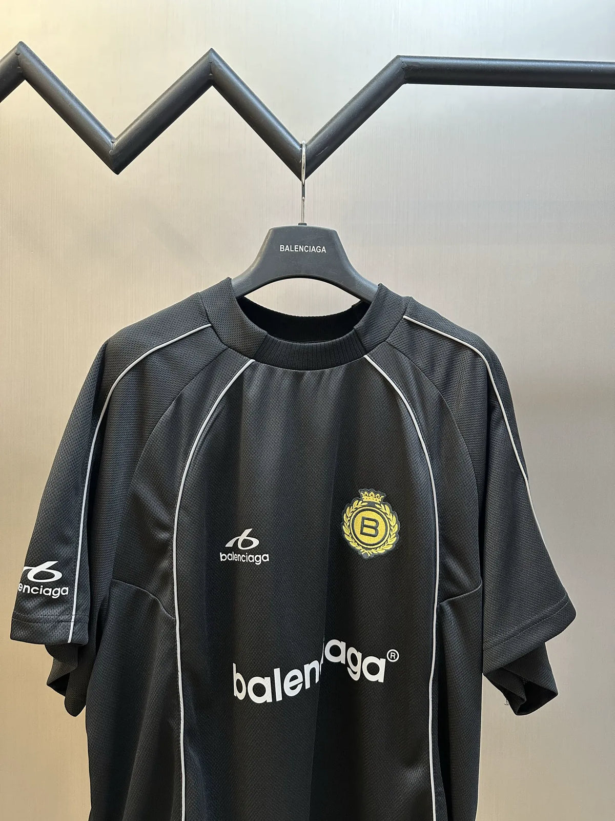 Black Balenciaga short-sleeve athletic jersey with front Balenciaga text and crest